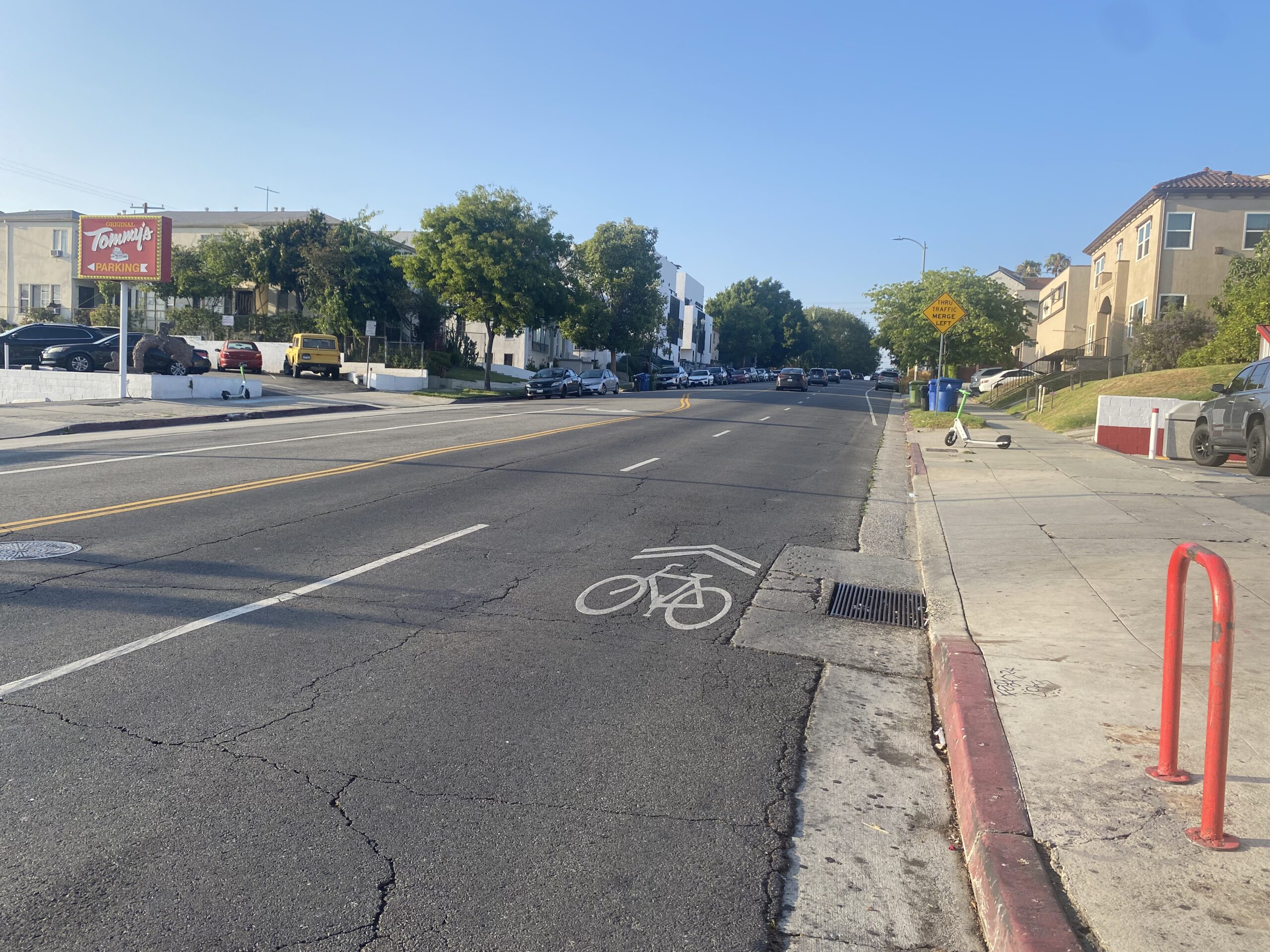 A bike route with a shared lane symbol (a bicycle with arrows over it as a lane marking). Along Rampart Boulevard at Beverly Boulevard.